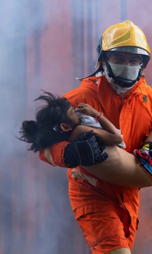 fire-fighting-team-rescue-life-saving-young-girl-from-fire-burn-and-handover-child-through-window-1-e1697080252646.jpg