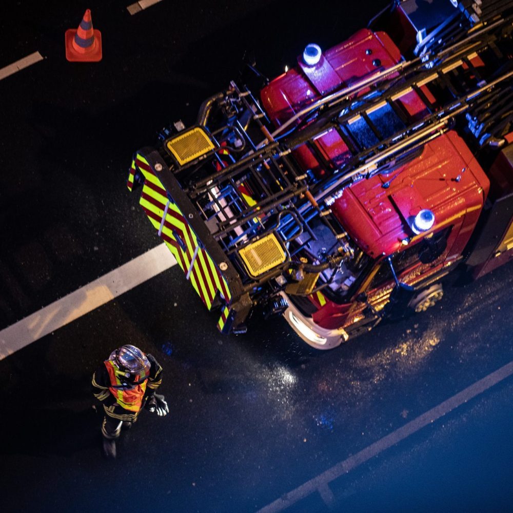 top-view-of-a-firefighter-beside-a-firefighter-truck-e1697092635491.jpg